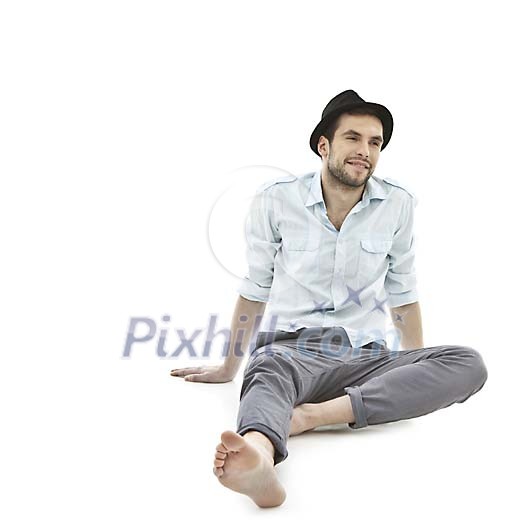 Isolated man sitting on the floor