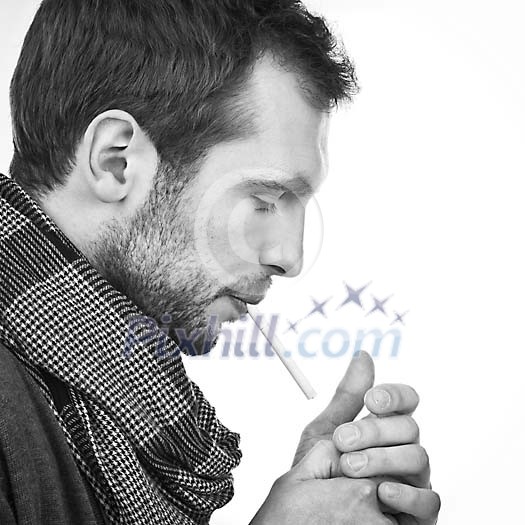 Man starting to light up a cigarette Man starting to light up a cigarette