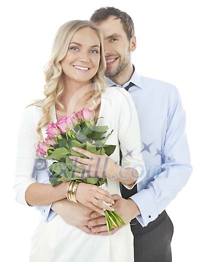 Isolated smiling couple with roses