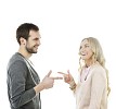 Isolated man and woman pointing fingers at eachother