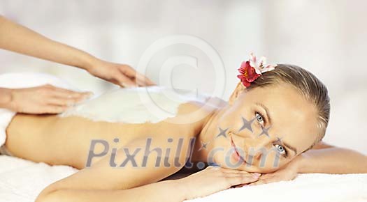 Woman enjoying spa treatments Woman enjoying spa treatments