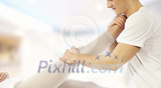 Male masseuse stretching clients leg Male masseuse stretching clients leg