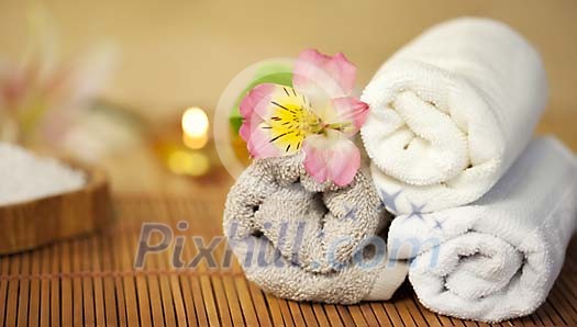 Towels with a flower in the spa