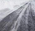 Asphalt covered in snow and ice