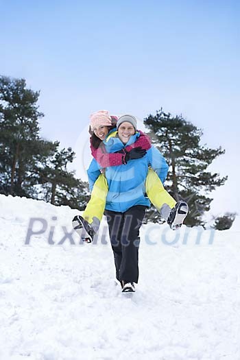 Couple having fun in the snow