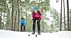 Couple skiing in the forest