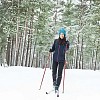 Woman skiing in the forest