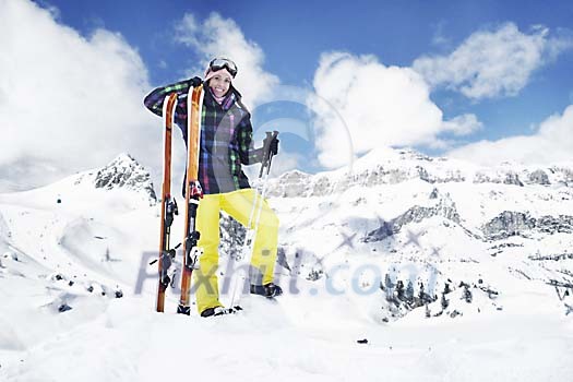 Woman standing on top of the snowy mountain