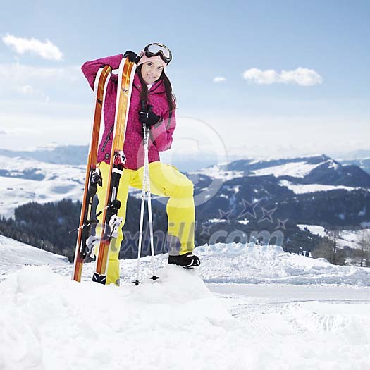 Woman standing on top of the mountain