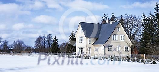 House by the snowy field