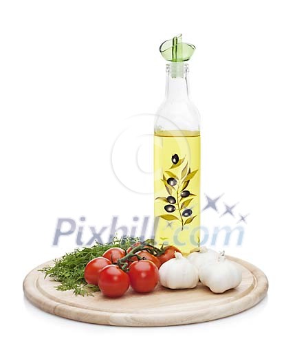 Isolated cuttingboard with olive oil and vegetables