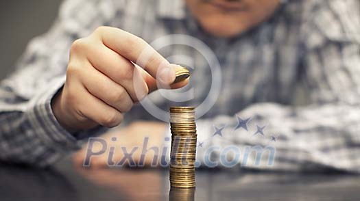 Male stacking coins