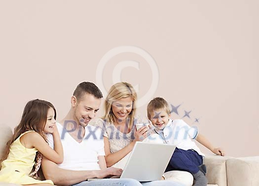 Family looking at the laptop