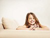 Smiling girl on a sofa
