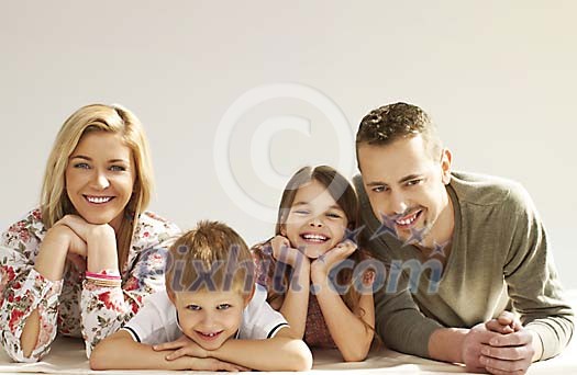 Smiling family on the floor
