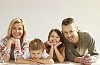 Smiling family on the floor