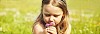Girl smelling summer flowers