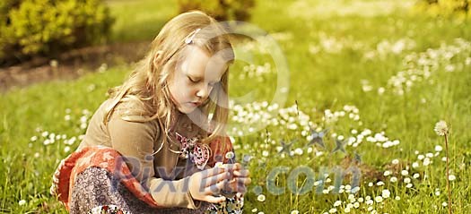 Girl picking flowers on the meadow Girl picking flowers on the meadow