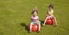 Two girls jumping on the rubber toys