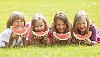 Children having slices of watermelon