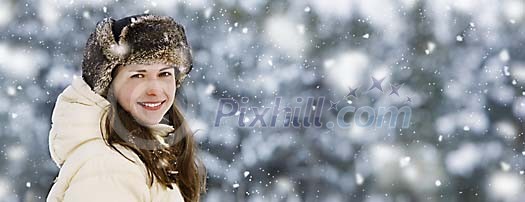 Smiling woman in snowfall