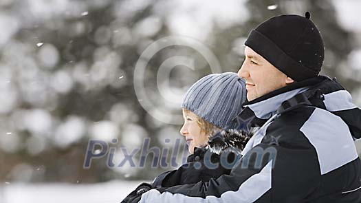 Father and son enjoying winter