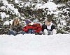 Teenagers sitting in the snow