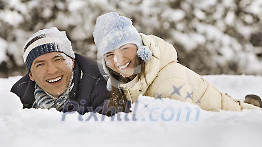 Couple smiling in the snow