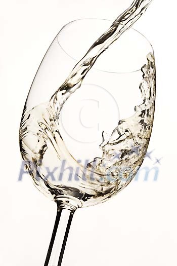 White wine being poured to the glass