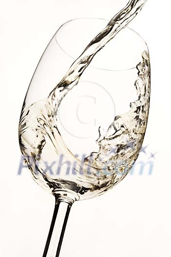 White wine being poured to the glass White wine being poured to the glass