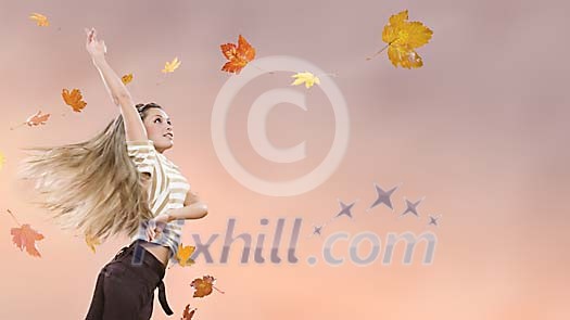 Female with flying autumn leaves