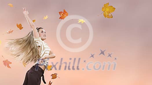 Female with flying autumn leaves Female with flying autumn leaves