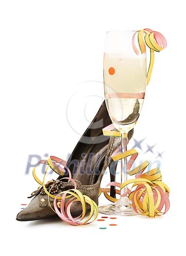 Isolated high heel shoe with a champagne glass and serpentine