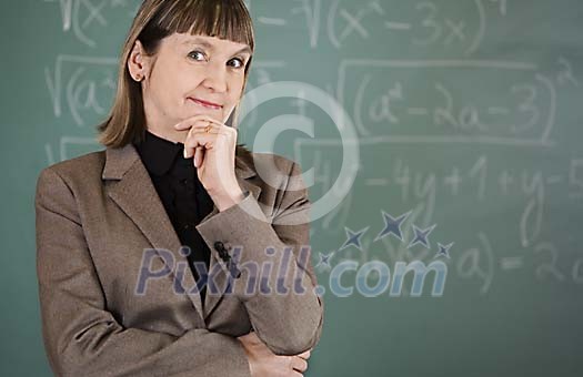 Mathematics teacher in front of blackboard
