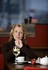 Woman sitting in cafeteria