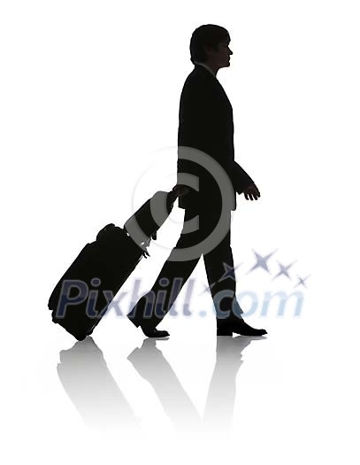 Silhouette of a man with suitcase from the side