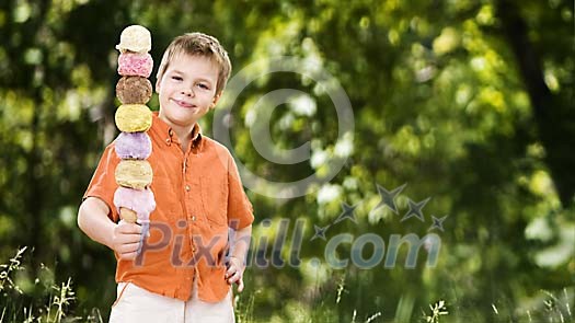 Young boy with a 7 ball ice-cream cone Young boy with a 7 ball ice-cream cone