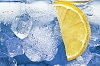 Close-up of lemon slice in water with ice
