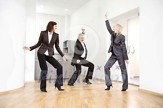 Business team dancing in office hall Business team dancing in office hall