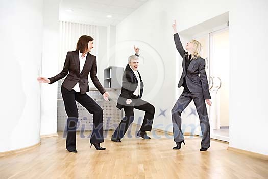 Business team dancing in office hall