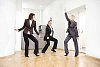 Business team dancing in office hall