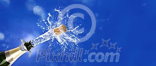 Sparkling champagne bottle popped open in front of stylish blue background Sparkling champagne bottle popped open in front of stylish blue background