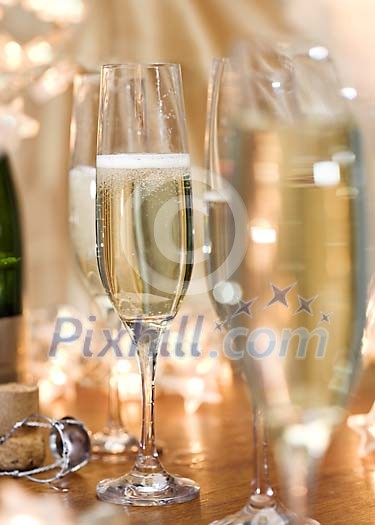 Shallow focus feeling of filled champagne glasses