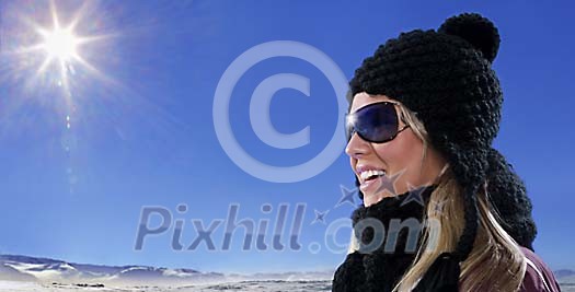 Beautiful girl smiling in black hat and scarf wearing trendy sunglasses