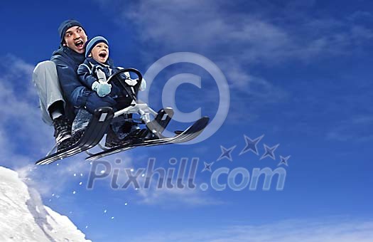 Daddy and son on a speedy bobsleigh ride