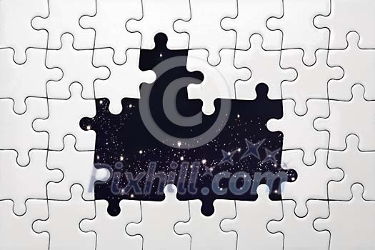 White puzzle with missing pieces in front of space view White puzzle with missing pieces in front of space view