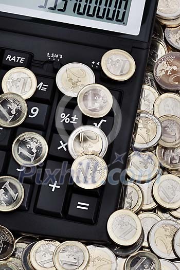 Euro coins on calculator keyboard