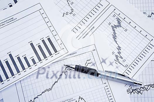 Financial graphs with pen Financial graphs with pen