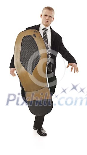 Manager giving boot (clipping path included)