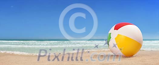 Lonely beach ball on the beach panorama